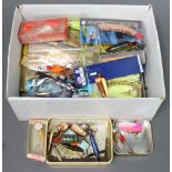 A collection of vintage fishing lures including a boxed Heddon box lure, a Bill Norman box lure,