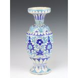 An Isnic style oviform vase with flared neck decorated with formal flowers 32cm There is fritting to