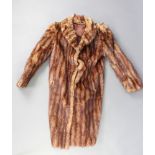 A lady's full length fur coat There is some molt to this coat and the lining to the back is