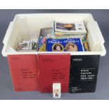 A white plastic crate containing a collection of tea cards