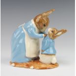 A Beswick Ware Beatrix Potter limited edition figure - Mrs Rabbit and Peter no.972 of 2500, 14cm,