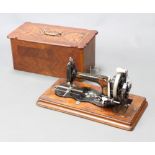 Robert Reid, a German made manual sewing machine no.256422 complete with carrying case (lid to