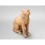 A carved hardwood figure of a seated tiger 54cm h x 43cm w x 16cm d