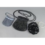 A lady's black sequined evening bag and 2 others