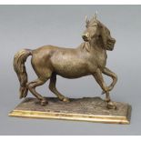 A bronze figure of a walking horse raised on a rectangular base 20cm h x 25cm w x 9.5cm d We believe