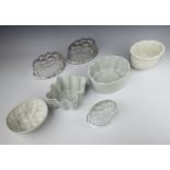 A Shelley white glazed jelly mould 11cm, 3 others and 3 glass ditto