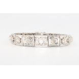 A white metal diamond bracelet set graduated stones, 18cm, 20 grams, approx. 2.3ct