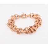 A 9ct rose gold triple link bracelet 10.7 grams