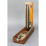 A Sphygmomanometer contained in a wooden case (F)