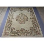 A white ground and floral patterned Indian carpet with central floral medallion 367cm x 278cmSome