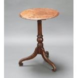 A circular mahogany and oak wine table raised on pillar and tripod base 73cm h x 51cm diam. Top