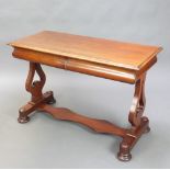 A Victorian bleached mahogany side table fitted 2 drawers, raised on urn shaped supports with shaped