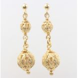 A pair of silver gilt earrings 3 grams and a pair of 9ct yellow gold earrings 2.7 grams