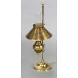 A table lamp in the form of a Victorian brass oil lamp with glass chimney 66cm h x 16cm