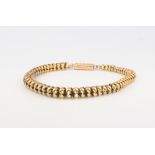 A 9ct yellow gold tapered bead bracelet 20cm, 9.6 grams