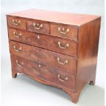 A Georgian mahogany chest of 3 short and 3 long drawers with oval ivory escutcheons and brass swan