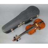 A child's violin, with 2 piece back 28.5cm, labelled Finally James Hay, prepared Guildford 1919,