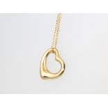 An 18ct yellow gold Tiffany & Co heart shaped pendant and chain, boxed, 4.2 grams