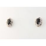 A pair of 9ct yellow gold oval sapphire and diamond ear studs 1.6 grams