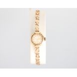 A lady's 9ct yellow gold Rotary wristwatch on a ditto bracelet 7.7 grams