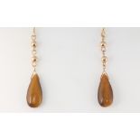 A pair of 9ct yellow gold tigers eye drop earrings