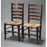 An 18th Century elm ladder back dining chair with woven rush seat, raised on turned supports, 98cm h