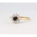 A yellow metal sapphire and diamond cluster ring, size J 1/2, 1.8 grams