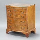 A Georgian style crossbanded walnut chest of serpentine outline fitted a brushing slide above 4 long