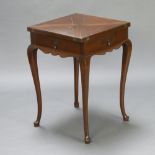 An Edwardian square oak envelope card table fitted 4 drawers, raised on cabriole supports 77cm h x