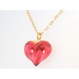 A Lalique twisted heart red glass pendant on an 18ct yellow gold chain 44cm, the chain 11 grams