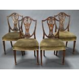 A set of 4 19th Century Hepplewhite style camel back dining chairs, the pierced shield backs with