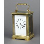 A 19th Century French 8 day carriage timepiece with enamelled dial contained in a gilt case 11cm x