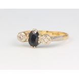 An 18ct yellow gold sapphire and illusion diamond set ring, size R, 3.6 grams
