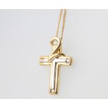 An 18ct yellow gold diamond set 2 colour cross pendant and chain 46cm, 5.2 grams