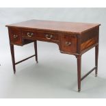 An Edwardian inlaid mahogany writing/dressing table fitted 1 long and 2 short drawers, raised on