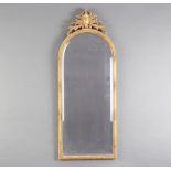 An arched bevelled plate mirror contained in a gilt frame 79cm x 31cm