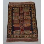 A red and brown Belouche rug with geometric design within multi row border 130cm x 88cm