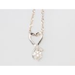 A 9ct white gold diamond set pendant gross weight 2.1 grams, on a 46cm chain