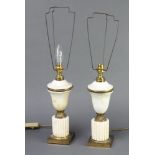 A pair of gilt metal and alabaster table lamps in the form of urns on square feet 28cm h x 10cm w