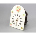 A Continental striking on bell wall clock, the arched painted dial decorated fruit and with Roman