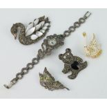 A silver and marcasite swan brooch, 3 other brooches and a wristwatch
