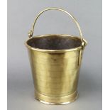 A polished brass bucket with swing handle 23cm x 27cm
