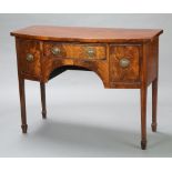 A Georgian style mahogany bow front sideboard fitted a drawer flanked by cupboard and further