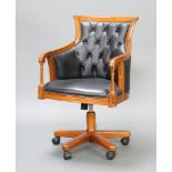 A 19th Century style show frame mahogany revolving office chair upholstered in black material 97cm h