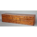 A Georgian crossbanded mahogany rectangular table top chest of 8 drawers with brass handles 21cm h x