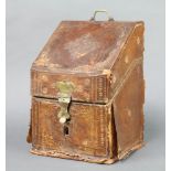 An 18th Century leather covered, wedge shaped, stationery box with fitted interior 28cm x 29cm x