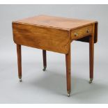 A Georgian mahogany Pembroke table fitted a frieze drawer, raised on square tapered supports,