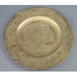 A Chinese gilt metal charger decorated a dragon the reverse with seal mark, marked china 31cm diam.