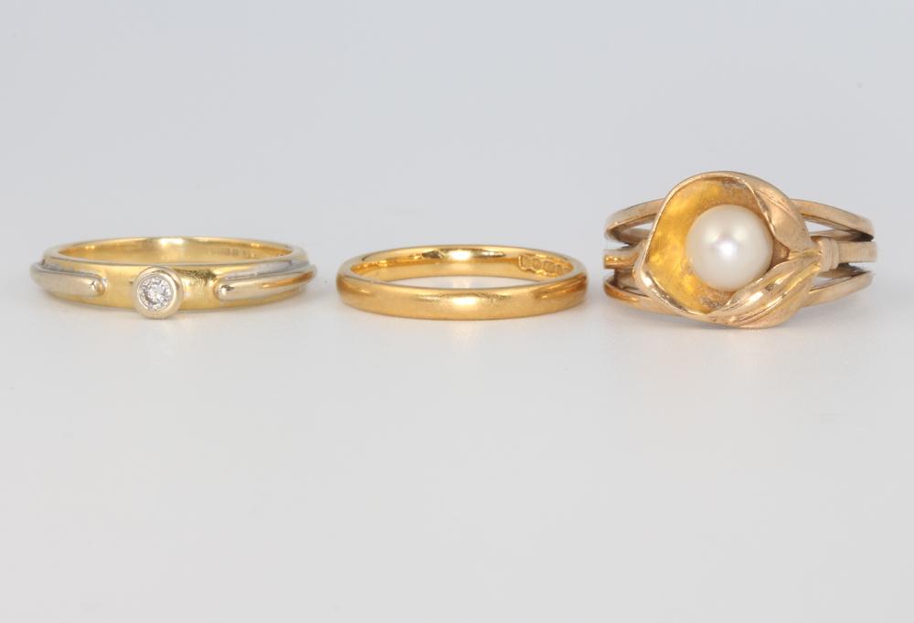 An 18ct yellow gold ring size L, 3.3 grams, a 9ct gem set ditto 4.7 grams, size M and a 22ct gold