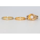 An 18ct yellow gold ring size L, 3.3 grams, a 9ct gem set ditto 4.7 grams, size M and a 22ct gold